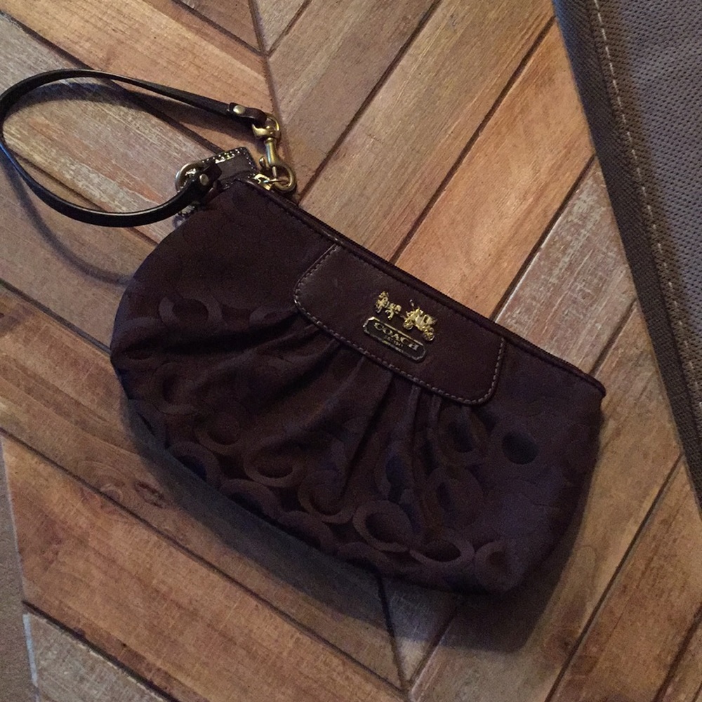 Small brown coach clutch